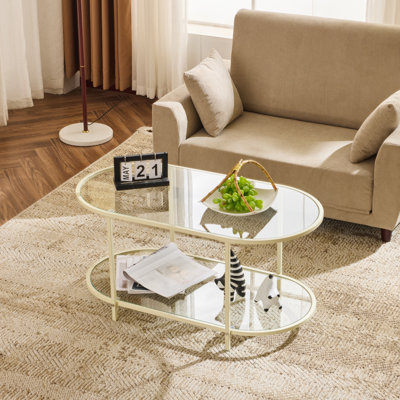 Structure ovale en fer beige et table basse à double couche en verre transparent