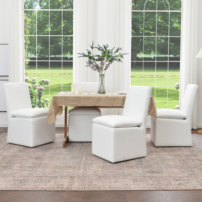 Chaise de salle à manger rembourrée en lin 21 po avec roulettes interchangeables et pieds fixes (ensemble de 4)