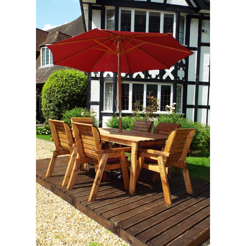 Faulkner 6 - Person Wood Patio Dining Set with Rectangular Table , Cushions Included, Burgundy