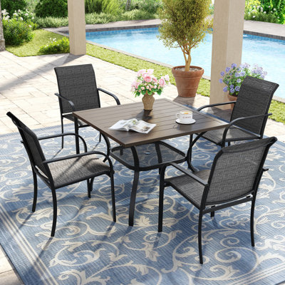 4-Person Square Patio Dining Set With Stackable PVC-coated polyester Chairs