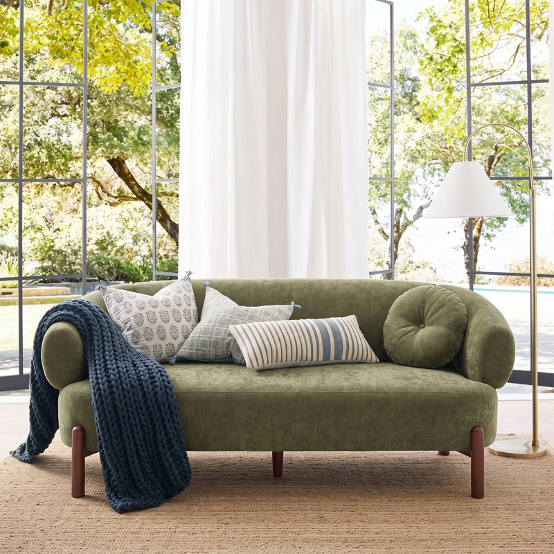 Canapé 3 places incurvé moderne Orenzo de 195 cm de large en polyester, avec coussins ronds capitonnés et pieds en bois de bouleau