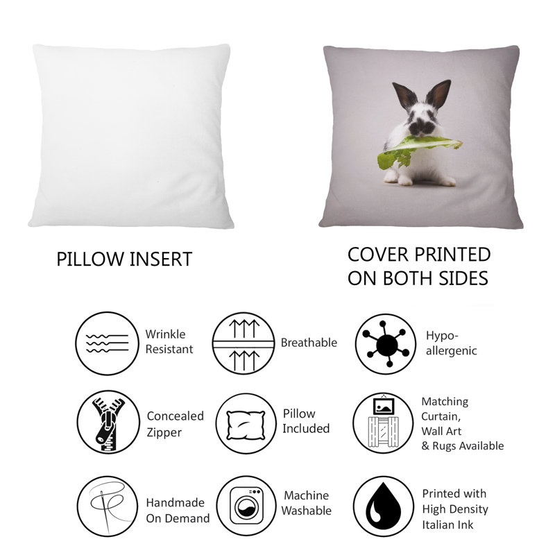 Coussin décoratif noir et blanc avec une feuille verte et un imprimé traditionnel