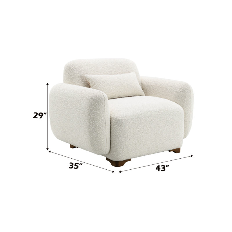 Fauteuil beige avec tissu et coussin décoratif attrayant
