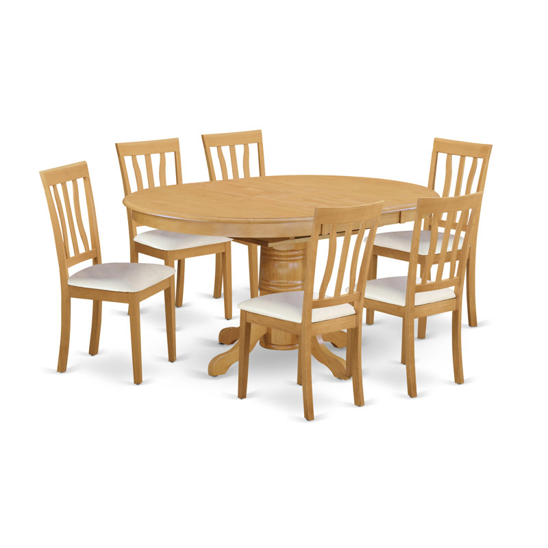 L'ensemble de salle à manger 7 pièces pour 6 personnes comprend une table de cuisine ovale avec rallonge papillon et 4 chaises de cuisine en similicuir, chêne