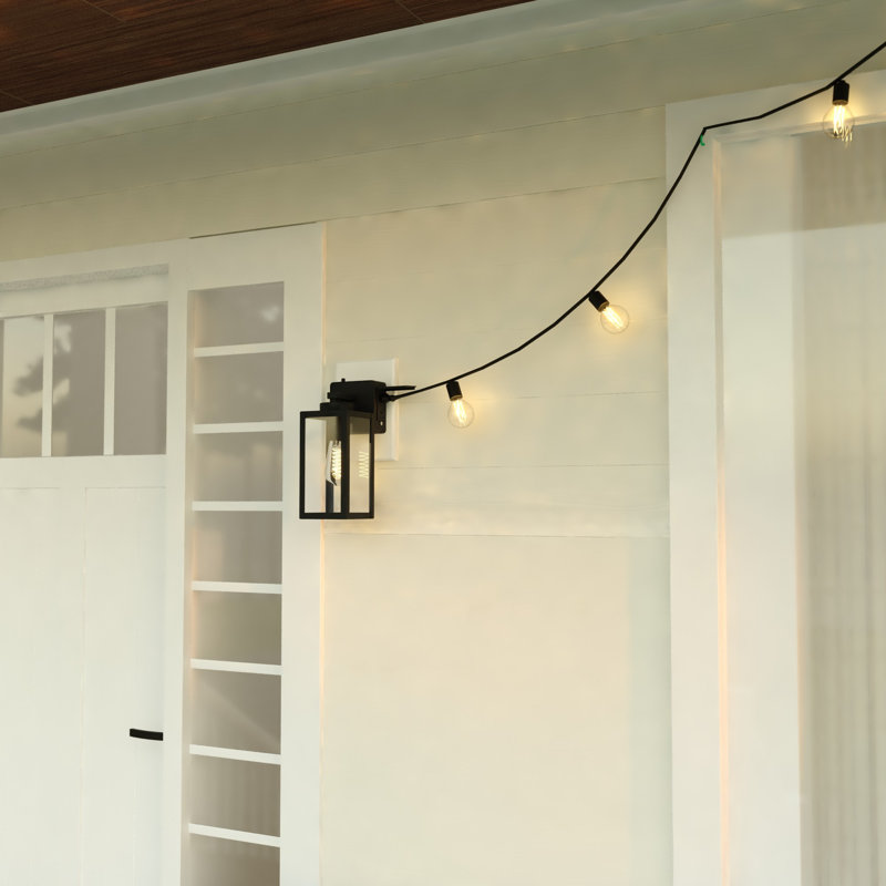Anderton 12.25 in. H 1-Light Textured Black Dusk to Dawn Sensor Outdoor Wall Sconce, Durable Metal, Clear Glass Shade, LED Compatible for Exterior Porch Patio Front Door or Garage