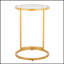 Table de bout ronde en métal doré avec plateau en verre transparent Zenn, parfaite pour les espaces de vie modernes et élégants