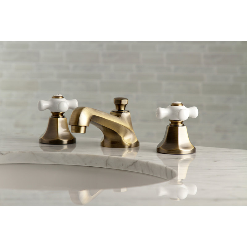 Kingston Brass Metropolitan Two-Handle 3-Hole Deck Mount Widespread Bathroom Faucet with Brass Pop-Up Drain, Antique Brass