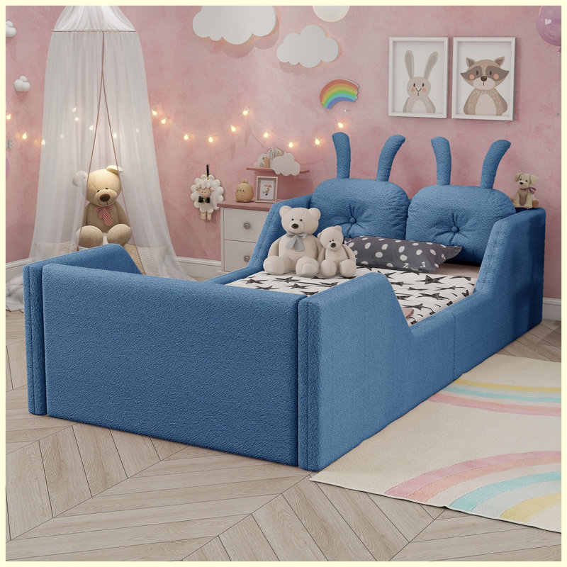 Lit plateforme simple tapissier bleu pour enfants avec coussin en lapin et rails latéraux amovibles