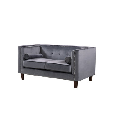 Causeuse en velours capitonné Chesterfield