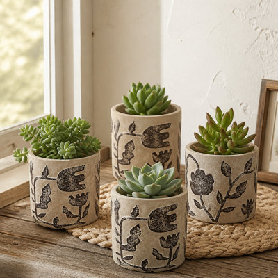 Ensemble de 4 jardinières en sable et ciment avec motifs botaniques