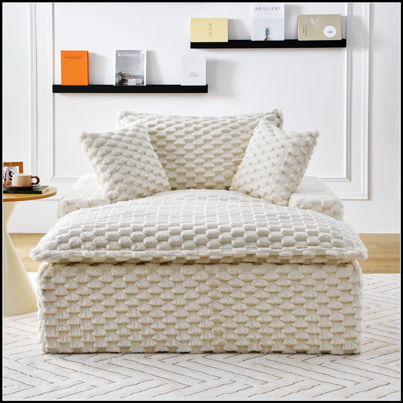 Canapé polyvalent de 130 cm d'épaisseur, confortable et doté de coussins et d'un dossier, idéal pour se détendre dans le salon ou la chambre.