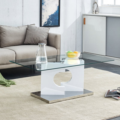 Une table basse rectangulaire moderne et tendance avec plateau en verre trempé et pieds en panneau de fibres à densité moyenne blanc. Convient au salon. Table basse rectangulaire de style simple moderne. 27,2 po x 25,5 po x 18 po.