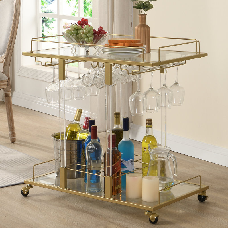 Chariot-bar en métal et acrylique Kibwe avec tablettes en verre et porte-verres à pied, Doré