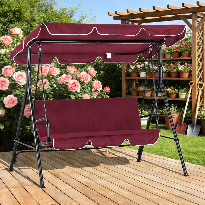 Balancelle d'extérieur pour terrasse avec banc trois places, coussins et auvent résistant aux intempéries. Structure robuste en acier, dossier rembourré moelleux.