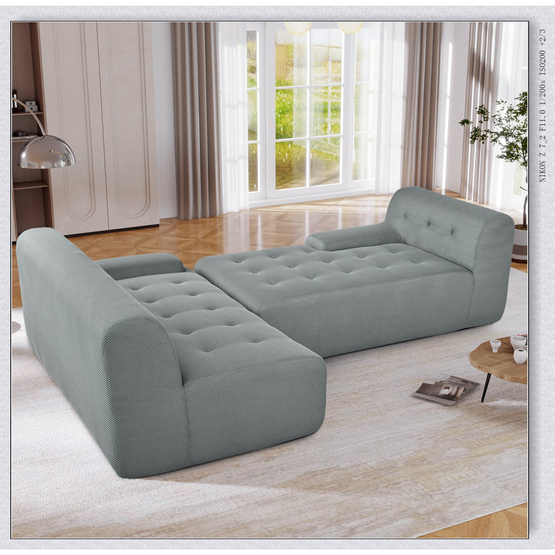 Grand canapé modulaire moderne en forme de L, style minimaliste avec sièges confortables et options de configuration polyvalentes