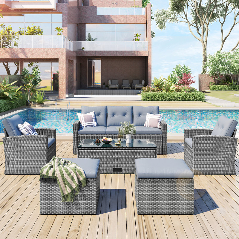 Ensemble de conversation modulaire en rotin 6 pièces avec table basse, canapés en osier, repose-pieds et coussins amovibles