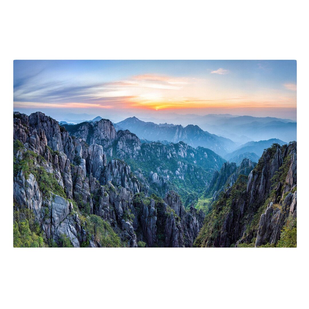 Leinwandbild Sonnenaufgang über dem Huangshan Gebirge