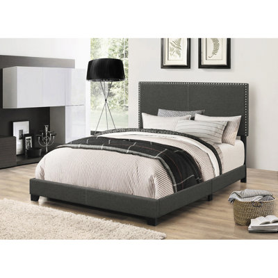 Très grand lit à panneau gris anthracite au fini gris fumé, de forme classique et à quatre pieds