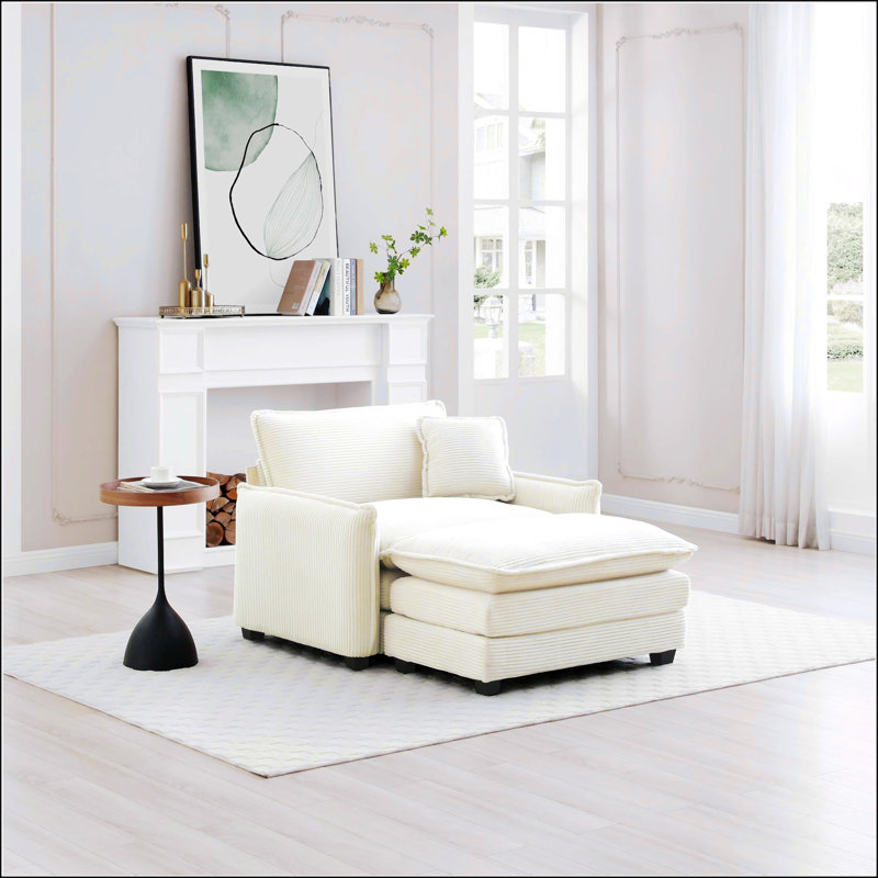 Canapé simple à siège profond avec repose-pieds et un coussin