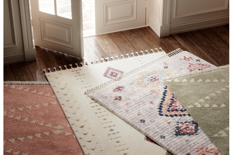 front entryway with four different rugs