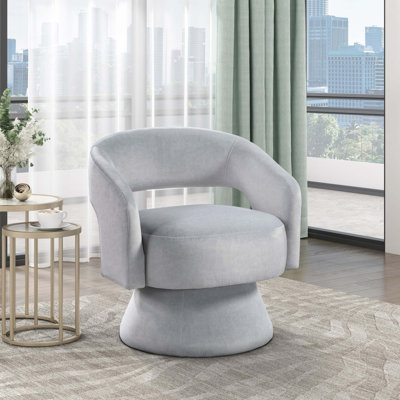 Fauteuil rembourré en velours avec base ronde