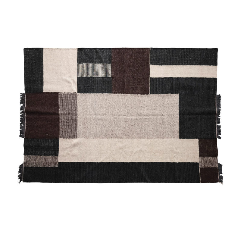 Tapis en laine et en coton avec motif géométrique et frange