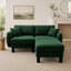 Canapé d'angle 2 places en tissu bouclé, avec accoudoirs originaux en forme de coquillage et pouf amovible, pieds cylindriques recouverts du même tissu, coloris vert.