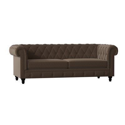 Canapé Chesterfield à accoudoirs roulés