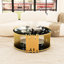 Modern minimalist light luxury style stainless steel circular coffee table, black tempered glass countertop, living room coffee table