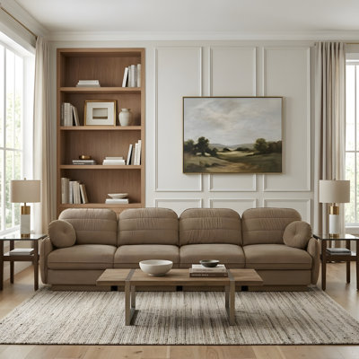 A deep-seated sofa in the living room, complete with round cushions