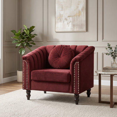 Red Upholstered Armchair with Channel Tufting, Rolled Arms and Nailhead Trim