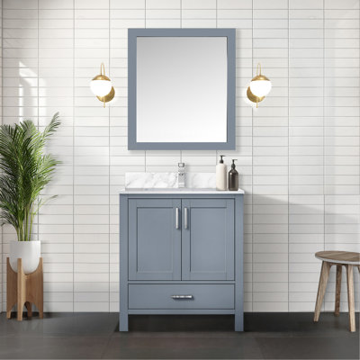 Meuble-lavabo gris foncé de 76 cm de largeur avec miroir de 71 cm, profondeur de 56 cm, un placard et un tiroir offrant beaucoup d'espace de rangement.