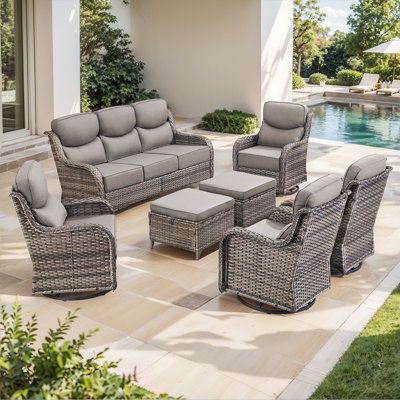 Meriline 7-Piece Outdoor Wicker Patio Conversation Set With 4 Swivel Gliders And Ottomans