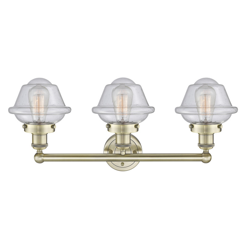 Éclairage pour meuble-lavabo à 3 lumières à intensité variable Grourke, Bullé, Laiton antique