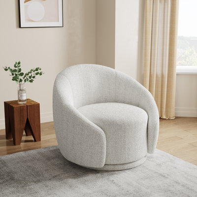 Fauteuil demi-tonneau pivotant rembourré Aunna