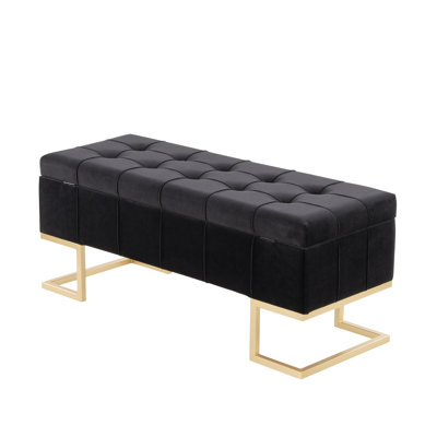 Banc de rangement contemporain avec revêtement en velours noir et pattes en métal doré