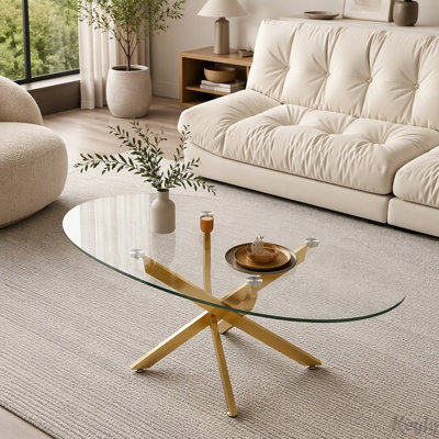 Table basse ovale en verre avec pieds en métal en forme de croix