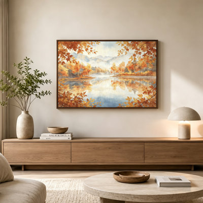 Tableau sur toile avec cadre flottant, représentant des arbres d'automne, des feuilles orangées, un lac serein et des montagnes brumeuses. Prêt à accrocher.