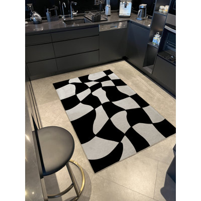Tapis en polypropylène à imprimé géométrique noir Vontae