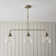 Anais 3lt Linear Pendant light finished in Ant. Brass
