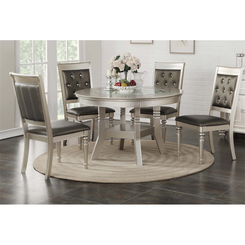 Ensemble de salle à manger classique argenté 5 pièces avec table ronde traditionnelle et chaises rembourrées, parfait pour des repas élégants.