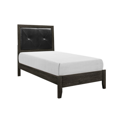 Lit simple contemporain avec tête de lit en faux cuir et rails pliables dans un cadre en bois gris foncé serein
