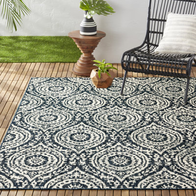 Tapis intérieur / extérieur bleu marine / ivoire Nicole Miller