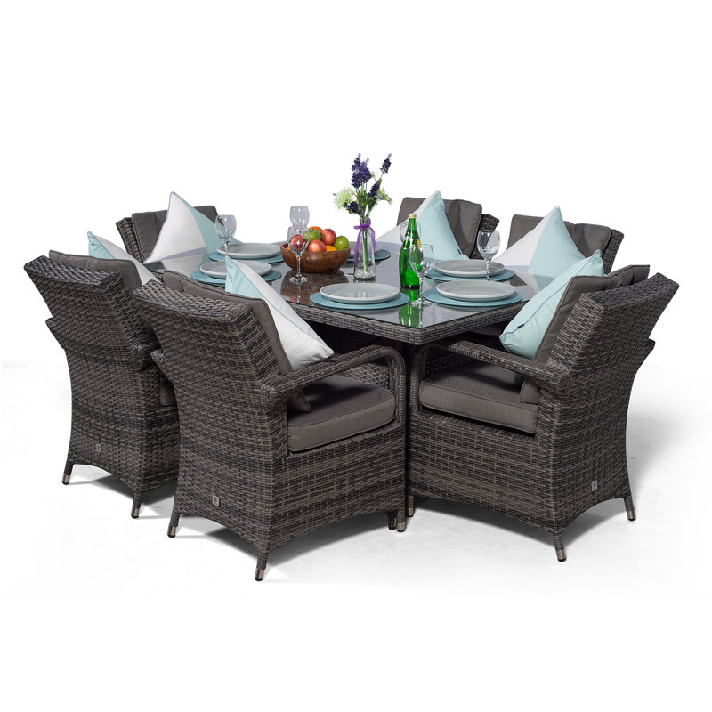 Karas 6 - Person Wicker Patio Dining Set with Rectangular Table , Cushions Included