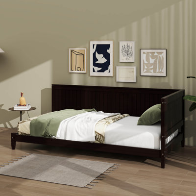 Sleek Minimalist Wooden Daybed Doubling As A Sofa Bed