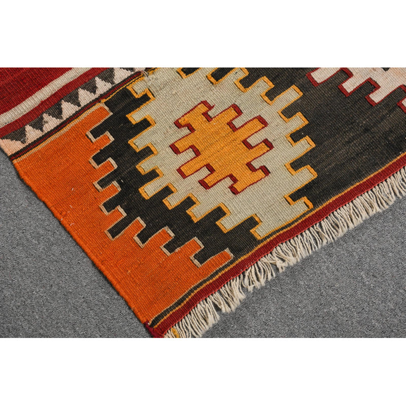 Tapis turc Kilim en orange avec des motifs géométriques éclatants pour une décoration intérieure unique