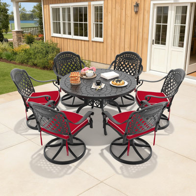 Ensemble de salle à manger d'extérieur 7 pièces en fonte d'aluminium, table ronde de 120 cm et 6 chaises pivotantes avec coussins rouges