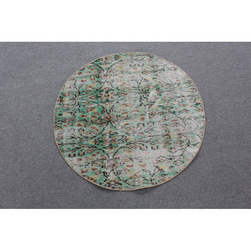 Tapis rond rond d'inspiration turque vert parfait pour une petite entrée ou un vestibule