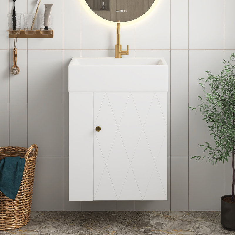 Meuble-lavabo blanc en panneau de fibres à densité moyenne de 20 po avec lavabo en céramique, porte à motif de losanges, poignée dorée et tablettes de rangement latérales avec barre à serviettes