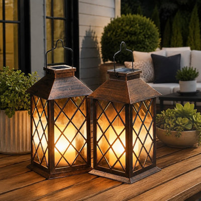 A [2 Pack] of 14" waterproof solar garden lanterns uses hanging construction and an LED flickering flameless candle for table or outdoor display, with a mission-style look suited to Mothers Day gifts for Mom or Wife.